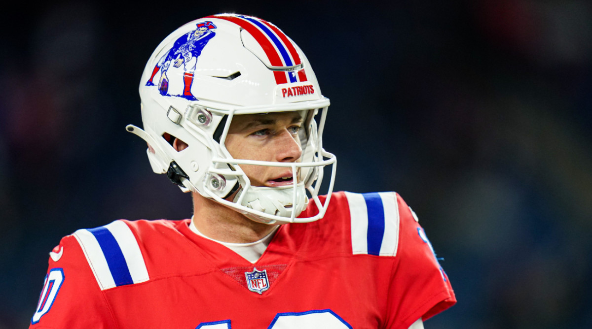 Patriots quarterback Mac Jones warms up in the throwback uniforms before the game vs. the Bills.